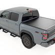 Load image into Gallery viewer, Rough Country Hard Roll Up Bed Cover | 5' Bed | Nissan Frontier 2WD/4WD (2022-2025) - Back View