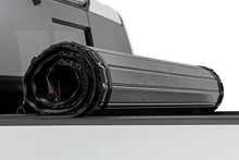 Load image into Gallery viewer, Rough Country Hard Roll Up Bed Cover | 5'7" Bed | Ram 1500 (19-26)/1500 TRX (21-24) - Installation View