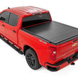 Load image into Gallery viewer, Rough Country Hard Roll Up Bed Cover | 6'7" Bed | Chevy/GMC Sierra 1500 (19-26)/Silverado 1500 (19-26) - Back View