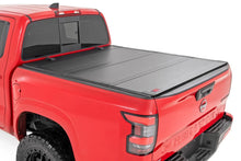 Load image into Gallery viewer, Rough Country Hard Tri-Fold Flip Up Bed Cover | 5' Bed | Nissan Frontier 2WD/4WD (22-26) - Main Product View