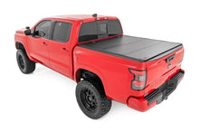 Load image into Gallery viewer, Rough Country Hard Tri-Fold Flip Up Bed Cover | 5' Bed | Nissan Frontier 2WD/4WD (22-26) - Installation View