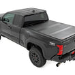 Load image into Gallery viewer, Rough Country Hard Tri-Fold Flip Up Bed Cover | 6' Bed | Toyota Tacoma 2WD/4WD (2024-2026) - Back View