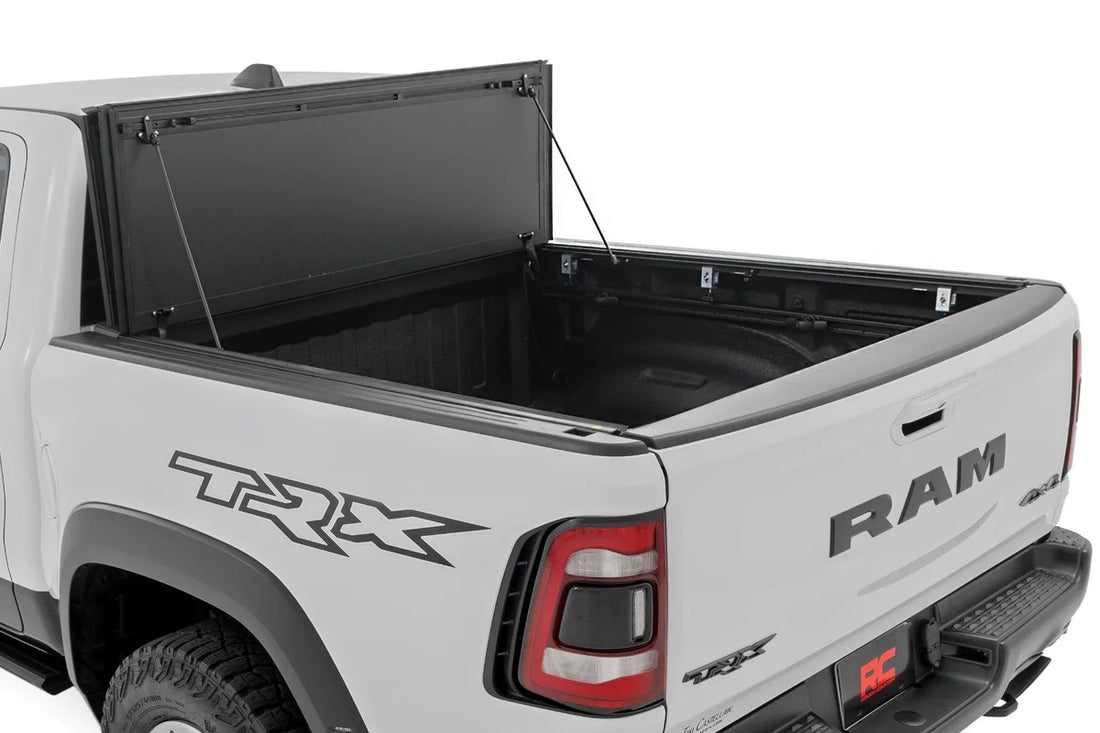 Rough Country Hard Tri-Fold Flip Up Fold Bed Cover | 5'7" Bed | Ram 1500 (19-25)/1500 TRX (21-24) 49320550 - Side View