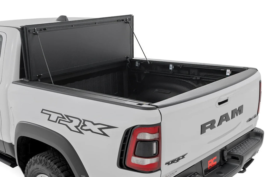 Rough Country Hard Tri-Fold Flip Up Fold Bed Cover | 5'7" Bed | Ram 1500 (19-25)/1500 TRX (21-24) 49320550 - Side View