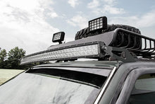 Load image into Gallery viewer, Rough Country LED Light Mount | Upper Windshield | 50" Curved | Jeep Grand Cherokee ZJ (93-98) 70567 - Installation View