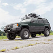 Load image into Gallery viewer, Rough Country LED Light Mount | Upper Windshield | 50" Curved | Jeep Grand Cherokee ZJ (93-98) 70567 - Installation View