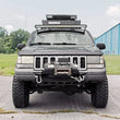 Load image into Gallery viewer, Rough Country LED Light Mount | Upper Windshield | 50" Curved | Jeep Grand Cherokee ZJ (93-98) 70567 - Installation View