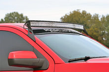 Load image into Gallery viewer, Rough Country LED Light Mount | Upper Windshield | 54" Curved | Chevy/GMC Tahoe/Yukon (15-20) 70514B - Installation View