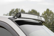 Load image into Gallery viewer, Rough Country LED Light Mounts | Upper Windshield | 54" Curved | Chevy/GMC 1500 (99-06 &amp; Classic) 70539 - Installation View
