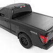 Load image into Gallery viewer, Rough Country Powered Retractable Bed Cover | 6'7" Bed | Ford F-150 (15-26)/F-150 Lightning (22-26) 51505650 - Back View