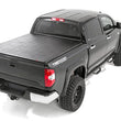 Load image into Gallery viewer, Rough Country Soft Tri-Fold Bed Cover | With &amp; W/O OE Rails | 6'7" Bed | Toyota Tundra (07-26) - Side View