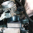 Load image into Gallery viewer, Rough Country Throttle Body Spacer | Jeep Cherokee XJ/Comanche MJ/Wrangler TJ 1068 - Installation View