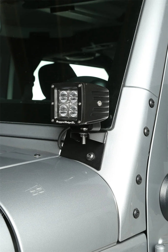 Rugged Ridge 07-18 Jeep Wrangler JK Textured Black Windshield Aux. Light Mounting Brackets - Installation View