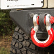 Load image into Gallery viewer, Rugged Ridge Red 3/4in D-Ring Isolator Kit - Installation View