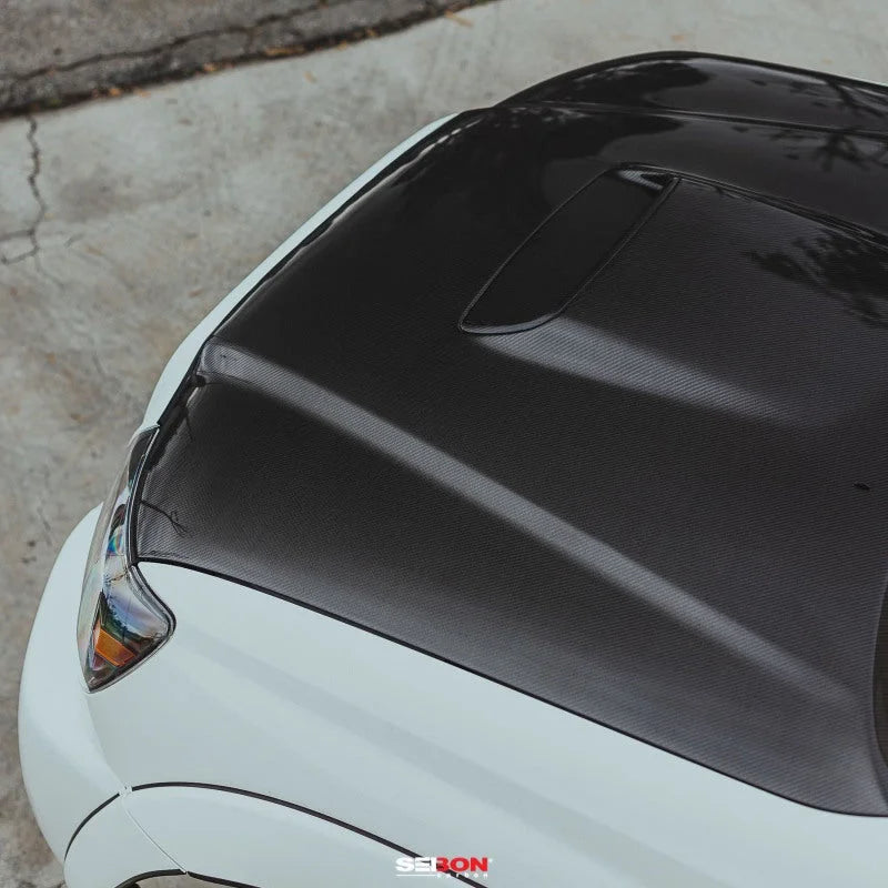 Seibon 05-11 Toyota Tacoma TR-Style Carbon Fiber Hood - Installation View