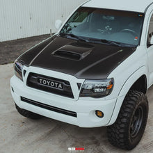 Load image into Gallery viewer, Seibon 05-11 Toyota Tacoma TR-Style Carbon Fiber Hood - Additional View 10