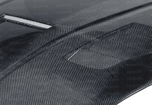 Load image into Gallery viewer, Seibon 07-08 Nissan 350z VT-style Carbon Fiber Hood - Installation View