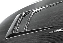 Load image into Gallery viewer, Seibon 08-12 Mitsubishi Lancer Evo X DV-Style Carbon Fiber Hood - Installation View