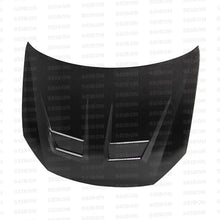 Load image into Gallery viewer, Seibon 10-11 VW Golf GTI 5K/MK6 DV Carbon Fiber Hood w/ Shaved Emblem - Detail View