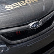 Load image into Gallery viewer, Seibon 11-13 Subaru Impreza/WRX/STi Carbon Fiber Front Grill - Installation View