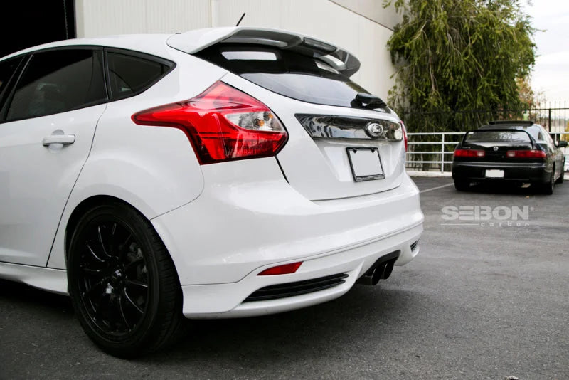 Seibon 12-13 Ford Focus 4 Door Carbon Fiber Tail Garnish - Main Product View