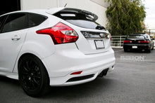 Load image into Gallery viewer, Seibon 12-13 Ford Focus 4 Door Carbon Fiber Tail Garnish - Main Product View