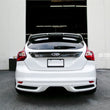 Load image into Gallery viewer, Seibon 12-13 Ford Focus 4 Door Carbon Fiber Tail Garnish - Installation View