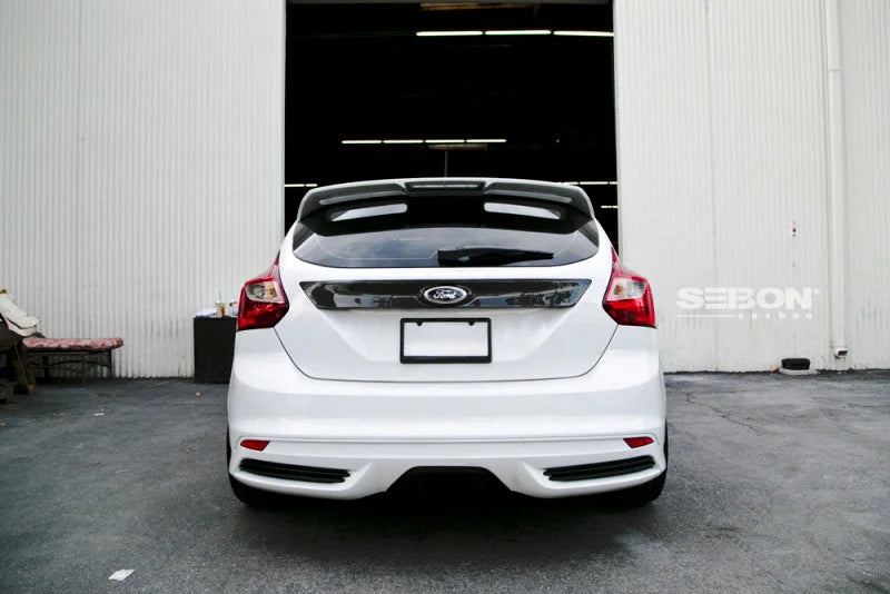 Seibon 12-13 Ford Focus 4 Door Carbon Fiber Tail Garnish - Installation View