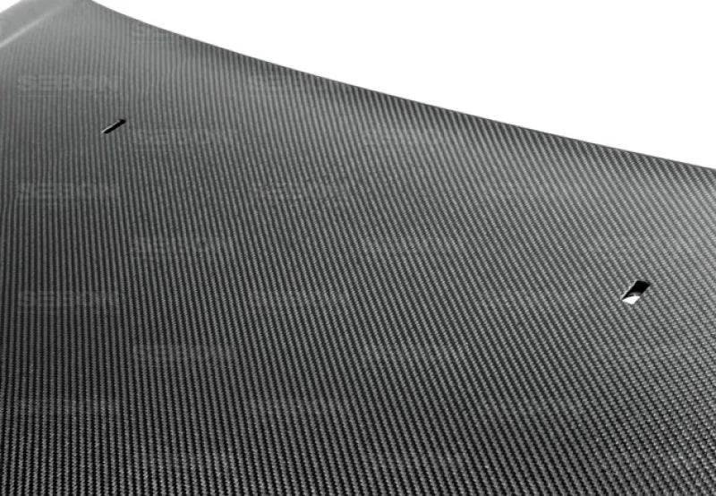 Seibon 12-13 Ford Focus OEM-Style Carbon Fiber Hood - Side View