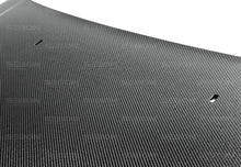 Load image into Gallery viewer, Seibon 12-13 Ford Focus OEM-Style Carbon Fiber Hood - Side View