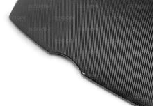 Load image into Gallery viewer, Seibon 12-13 Ford Focus OEM-Style Carbon Fiber Hood - Detail View