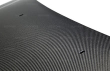 Load image into Gallery viewer, Seibon 12-13 Ford Focus RS-Style Carbon Fiber Hood - Installation View
