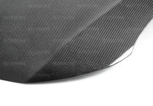 Load image into Gallery viewer, Seibon 14 Scion TC OE Style Carbon Fiber Hood - Installation View