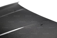 Load image into Gallery viewer, Seibon 15-16 Ford Focus OE Style Carbon Fiber Hood - Side View