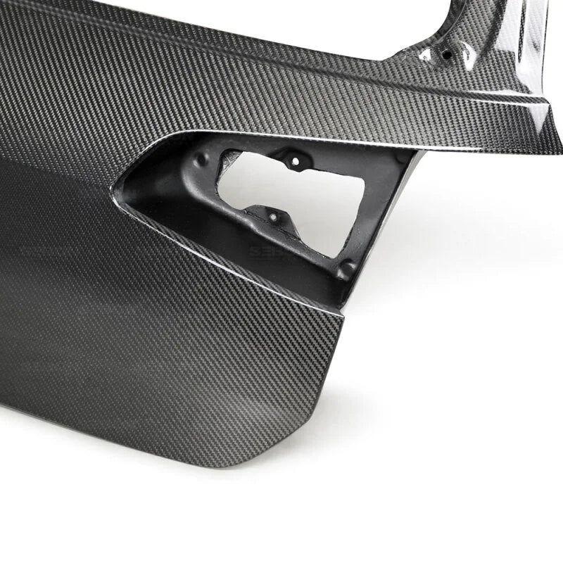 Seibon 15-19 Volkswagen Golf/GTI/Golf R OEM-Style Carbon Fiber Trunk Lid - Side View