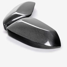 Load image into Gallery viewer, Seibon 19-24 Toyota Corolla Hatchback Carbon Fiber Mirror Caps - Installation View