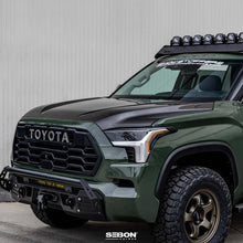 Load image into Gallery viewer, Seibon 22-23 Toyota Tundra OE Style Carbon Fiber Hood - Side View
