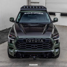 Load image into Gallery viewer, Seibon 22-23 Toyota Tundra OE Style Carbon Fiber Hood - Installation View