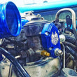 Load image into Gallery viewer, Sinister Diesel 03-07 Ford Powerstroke 6.0L Blue Spring Kit with Adjustable Billet Spring Housing - Side View