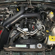 Load image into Gallery viewer, Spectre 97-06 Jeep Wrangler L6-4.0L F/I Air Intake Kit - Tex. Black w/Red Filter - Side View
