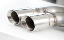 Load image into Gallery viewer, Stainless Works 2010-14 Ford Raptor Exhaust X-Pipe Turbo Resonator Front Passenger Rear Tire Exit - Installation View