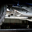 Load image into Gallery viewer, Stainless Works 2011-14 Ford F-150 Raptor Exhaust X-Pipe Resonator Dump In Front Of Rear Axle - Installation View