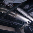 Load image into Gallery viewer, Stainless Works 2015-18 F-150 Exhaust X-Pipe Resonator Muffler Exits In Front Of Passenger Rear Tire - Side View