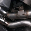 Load image into Gallery viewer, Stainless Works 2016-18 Cadillac CTS-V Sedan Axleback System Dual-Mode Turbo Mufflers 4in Tips - Installation View