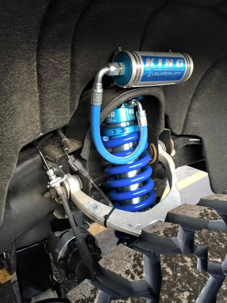 Superlift 07-16 Chevy Silv 4WD 8in Lift Kit w/ OE Cast Steel Control Arms & King Coilovers & Shocks - Side View
