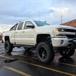 Load image into Gallery viewer, Superlift 07-16 Chevy Silv 4WD 8in Lift Kit w/ OE Cast Steel Control Arms &amp; King Coilovers &amp; Shocks - Installation View