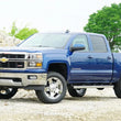 Load image into Gallery viewer, Superlift 14-19 Chevy Silv 4WD 3.5in Lift Kit w/ Alum Cntrl Arms Fox Front Coilover &amp; 2.0 Rear - Back View
