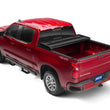 Load image into Gallery viewer, Tonno Pro 04-15 Nissan Titan 5.5ft (Incl 42-498 Utility Track Kit) Hard Fold Tonneau Cover - Installation View