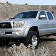 Load image into Gallery viewer, Tuff Country 05-23 Toyota Tacoma 4x4 &amp; PreRunner 3in Lift Kit (Excludes TRD Pro) SX6000 Shocks - Back View