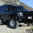 Load image into Gallery viewer, Tuff Country 87-01 Jeep Cherokee 4x4 3.5in Lift Kit EZ-Flex (SX6000 Shocks) - Side View